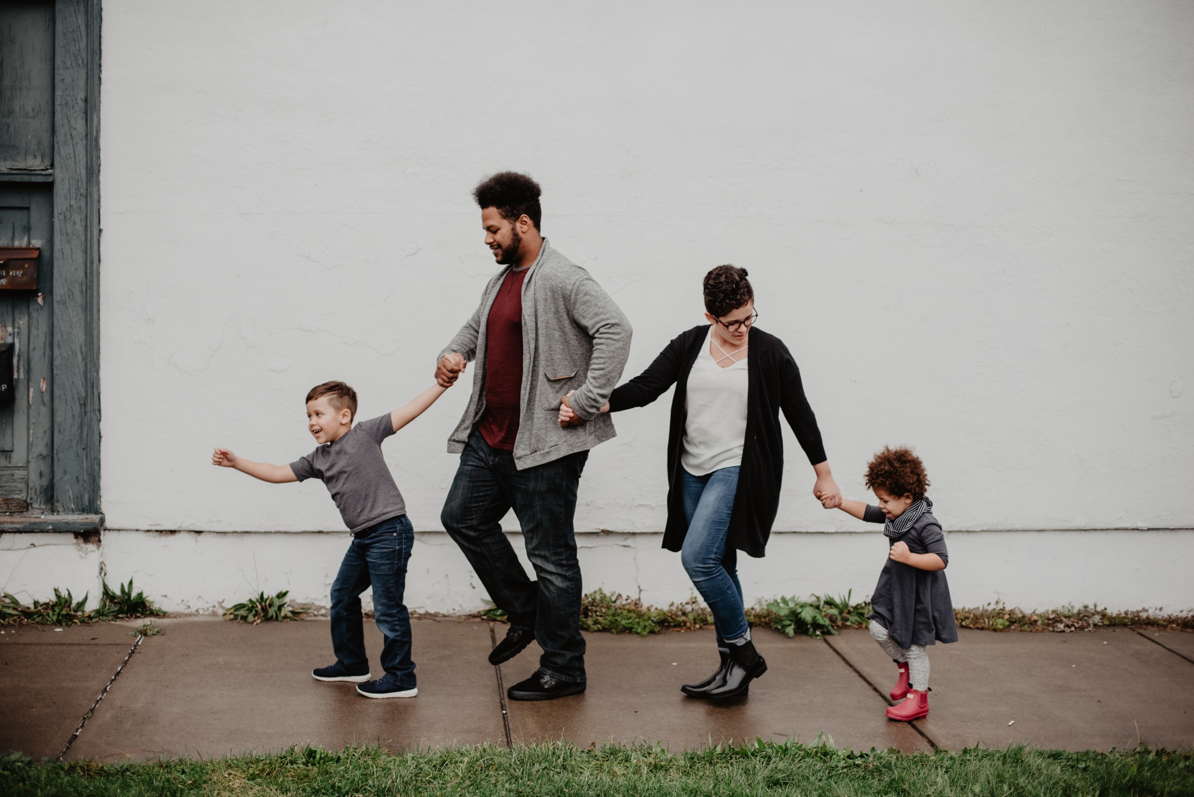 picture of family walking on sidewalk