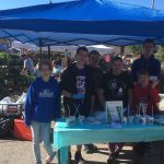 group of 4-H kids at a booth at the farmers market