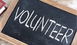 the word "volunteer" on a chalkboard