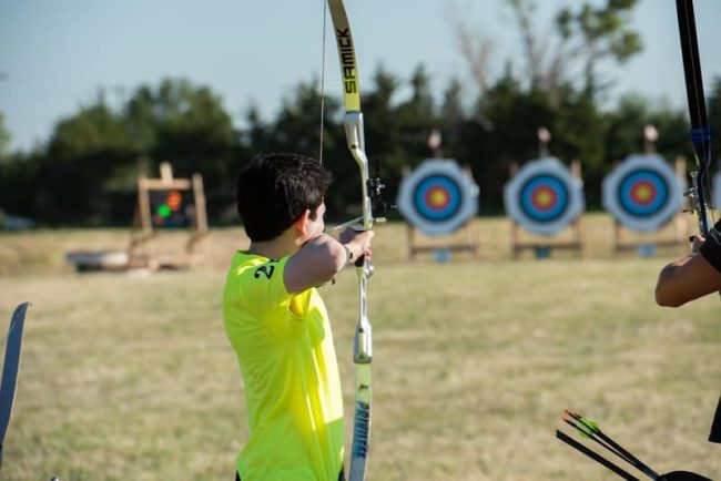 4-H youth using a bow and arrow