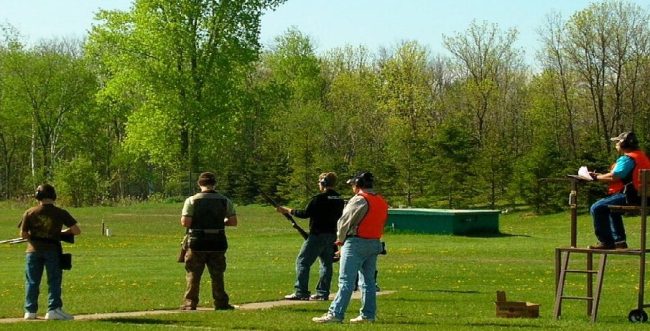 Young people outdoors at a shooting range