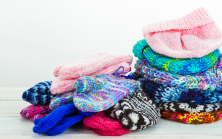 pile of mittens and hats