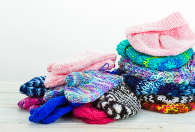 pile of mittens and hats