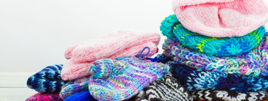 pile of mittens and hats
