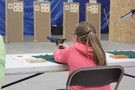 girls shooting an air pistol