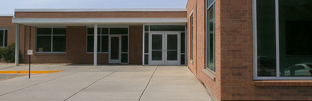 photo of the building housing the Extension office with the words "Extension office closed for Memorial Day"