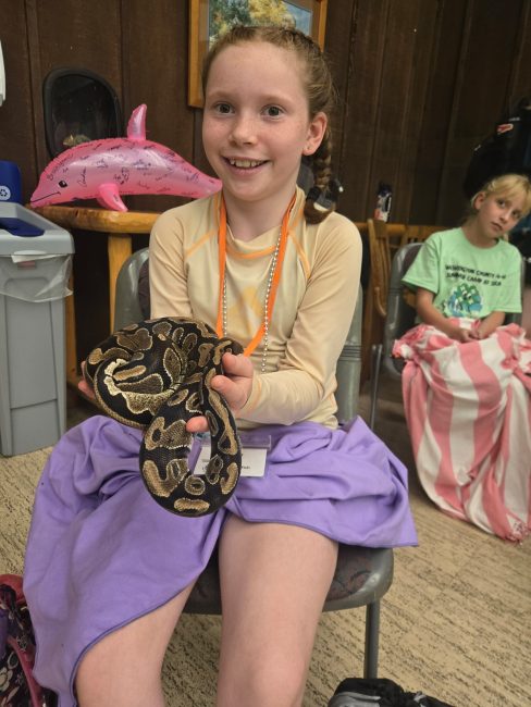 girl holding a snake