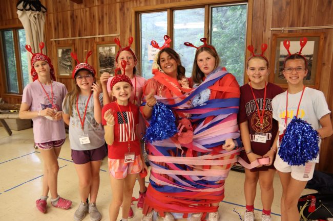 campers decorating their camp counselors