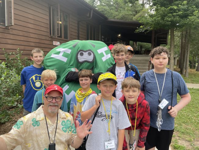 campers posing with person in Chris Clover costume