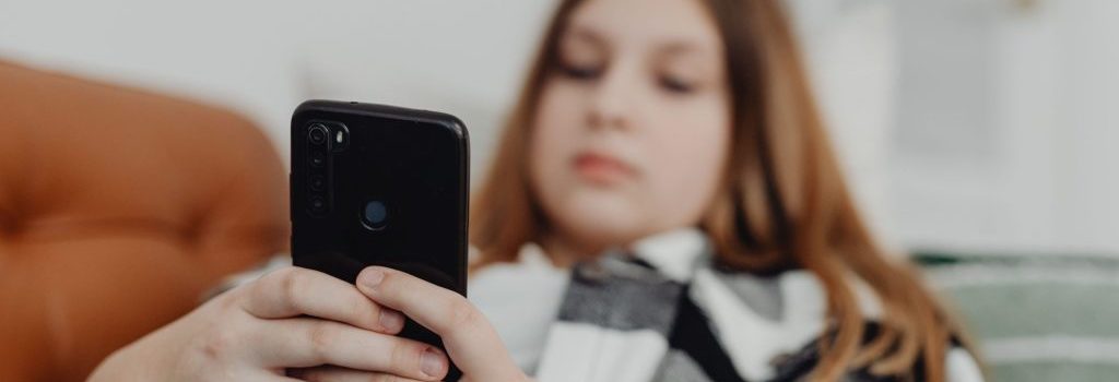 teen with phone